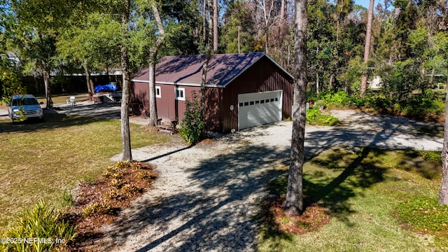 garage featuring a lawn