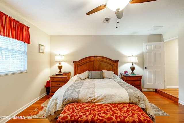 bedroom featuring hardwood / wood-style floors and ceiling fan