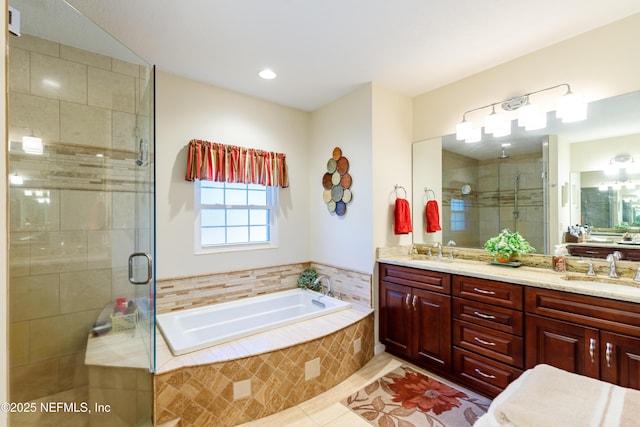 bathroom with vanity, tile patterned floors, and separate shower and tub