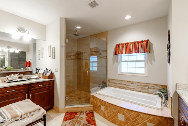 bathroom featuring tile patterned floors, vanity, and separate shower and tub