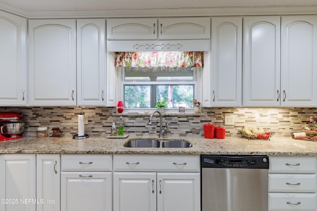 kitchen with sink, dishwasher, backsplash, light stone countertops, and white cabinets