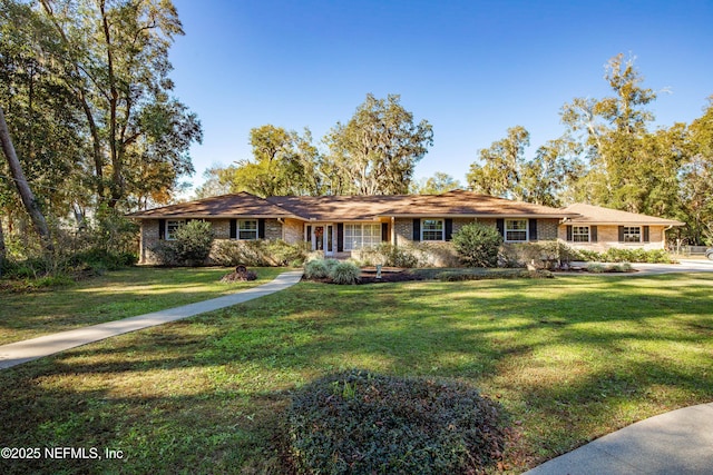 ranch-style home with a front lawn