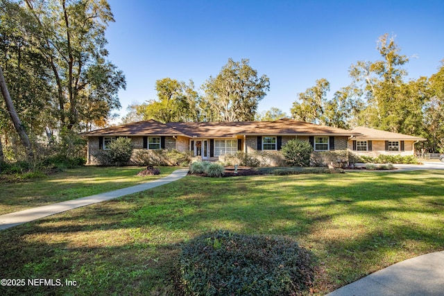 single story home featuring a front yard