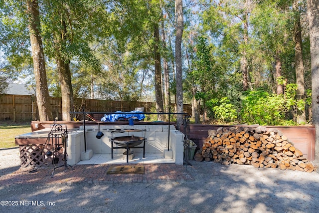 view of patio with an outdoor fire pit