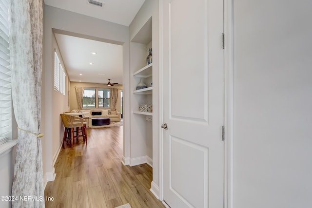 hall with light wood-type flooring