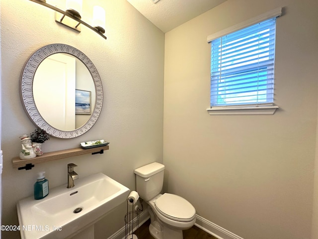 bathroom with sink and toilet