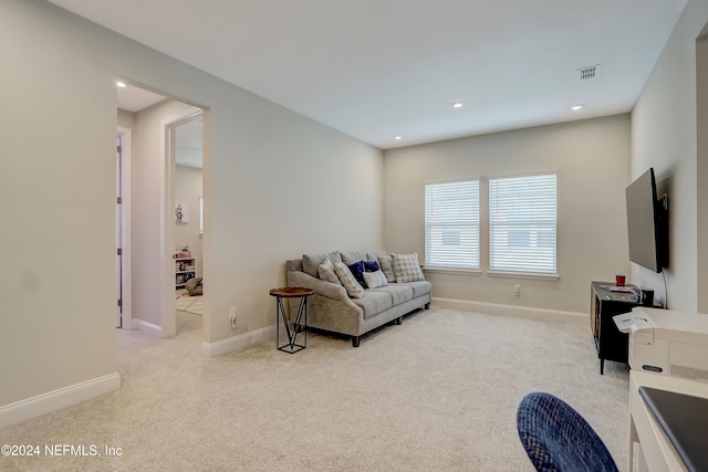 living room featuring light carpet