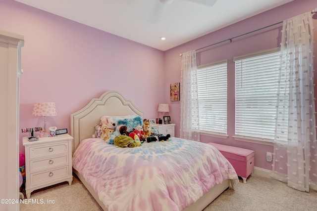 bedroom with light carpet and ceiling fan