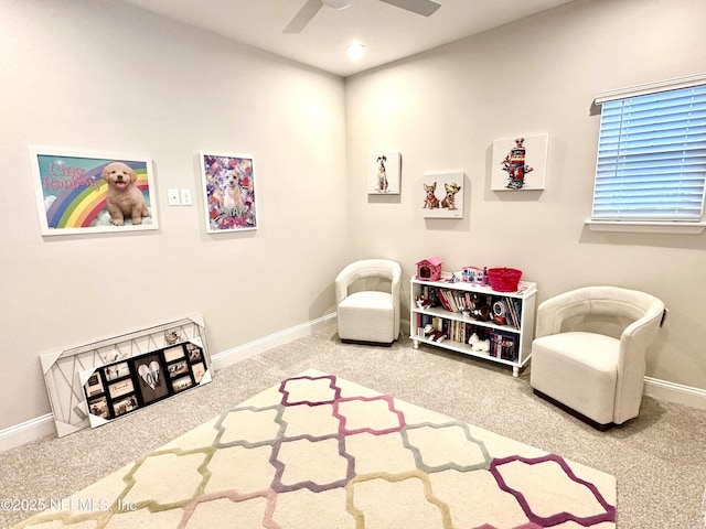 interior space with ceiling fan and carpet flooring