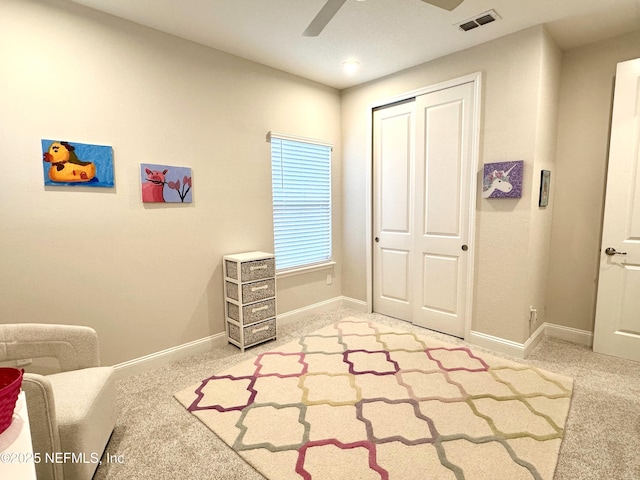 bedroom featuring carpet flooring, ceiling fan, and a closet