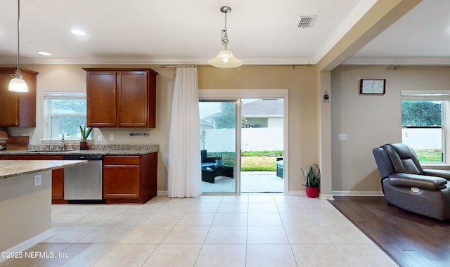 kitchen with light stone counters, stainless steel dishwasher, plenty of natural light, decorative light fixtures, and crown molding