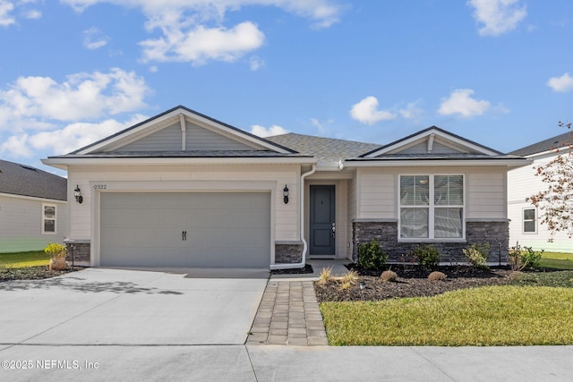 ranch-style home featuring a garage and a front yard