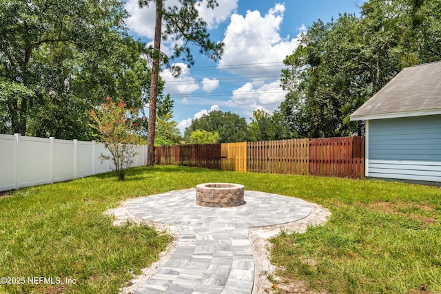 view of yard with a patio area and a fire pit