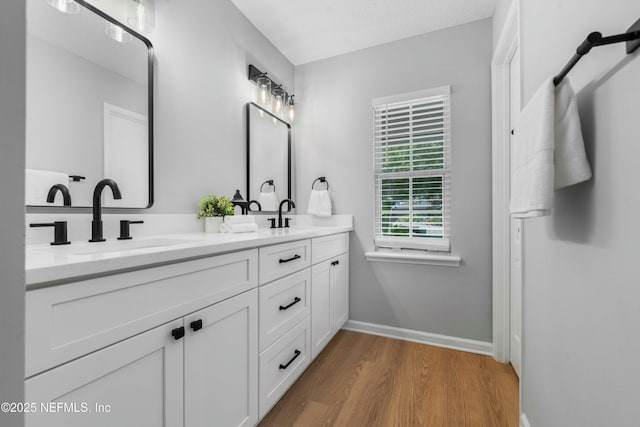 bathroom featuring vanity and hardwood / wood-style flooring