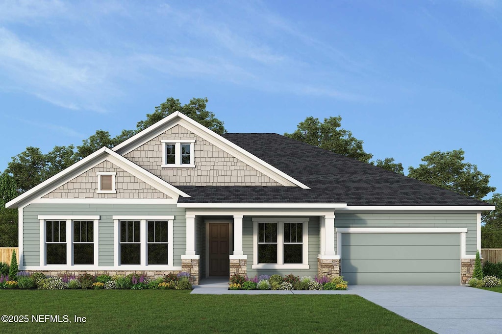 craftsman-style home featuring a garage and a front lawn