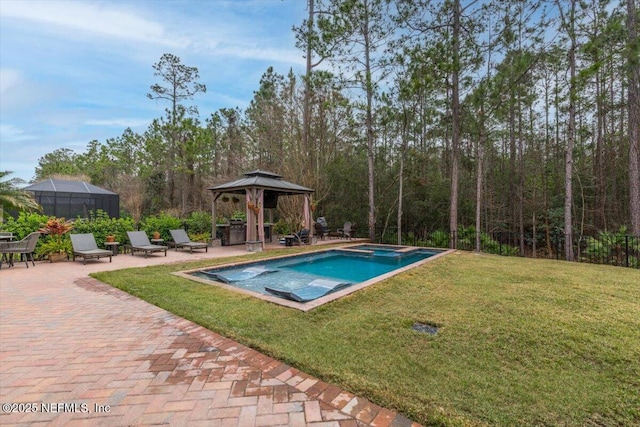 view of pool with a gazebo, a yard, a patio, and a pool with connected hot tub