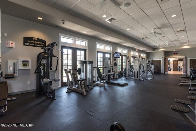 exercise room featuring visible vents, recessed lighting, baseboards, french doors, and a paneled ceiling