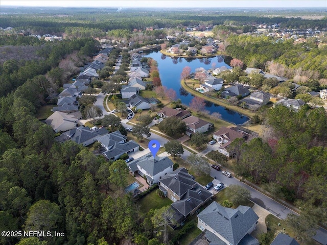 drone / aerial view featuring a residential view and a water view
