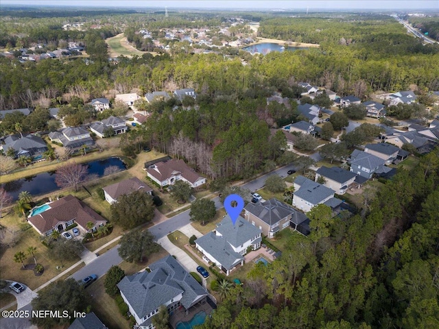 aerial view featuring a residential view and a water view