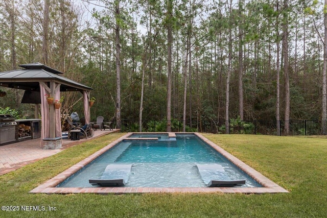 view of pool with a gazebo, a patio area, a lawn, and fence