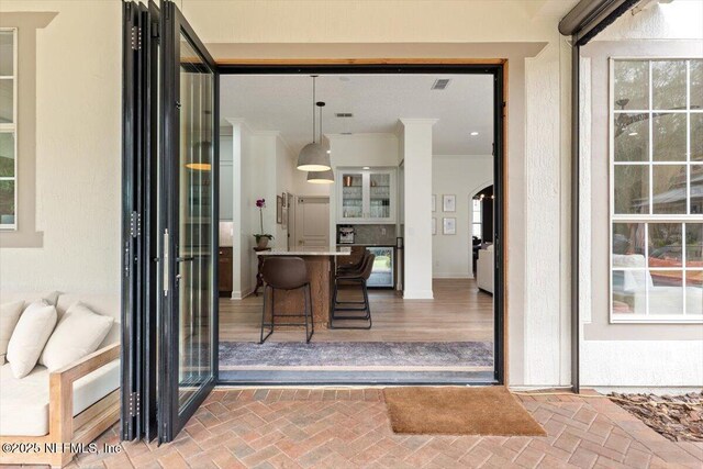 doorway to property featuring visible vents