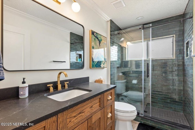 full bathroom featuring visible vents, toilet, a stall shower, ornamental molding, and vanity