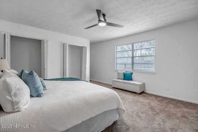 bedroom with ceiling fan, light colored carpet, and a textured ceiling