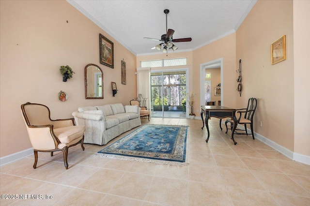 living room with ceiling fan, ornamental molding, a textured ceiling, and light tile patterned floors