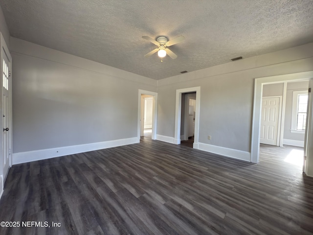 6624 Avalon St, Jacksonville, FL 32208 - interior space featuring dark wood-style floors, visible vents, a textured ceiling, and a ceiling fan