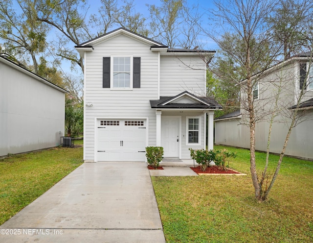 view of property with a garage and a front lawn