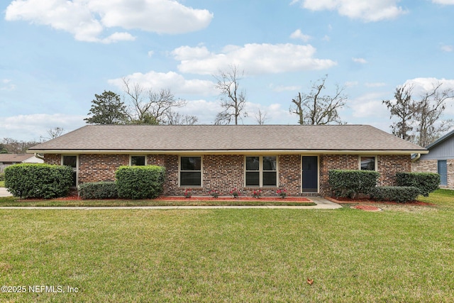 single story home featuring a front lawn