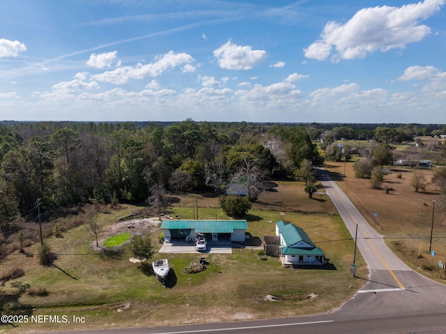 birds eye view of property with a rural view