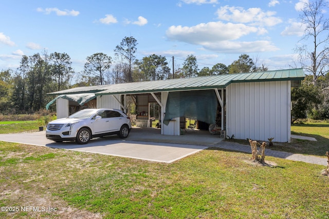 view of car parking featuring a lawn