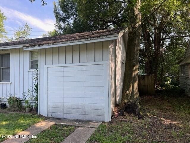 garage featuring fence