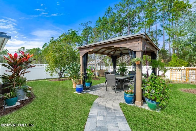 view of yard featuring a gazebo and a patio area