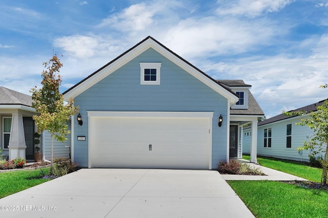 232 Fairlake Cir, Saint Augustine, FL 32092 - view of front facade featuring concrete driveway, roof with shingles, and a garage