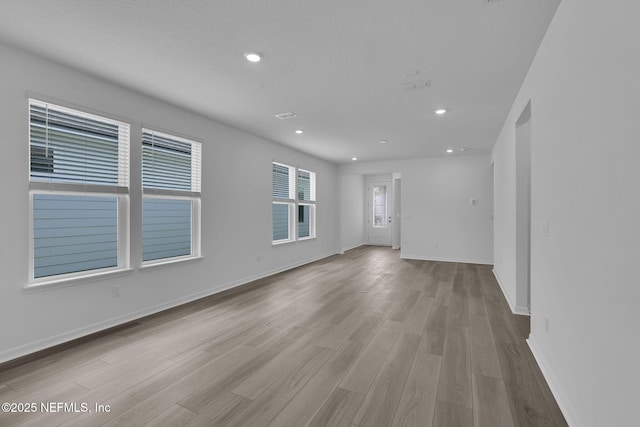 232 Fairlake Cir, Saint Augustine, FL 32092 - empty room with wood finished floors and recessed lighting