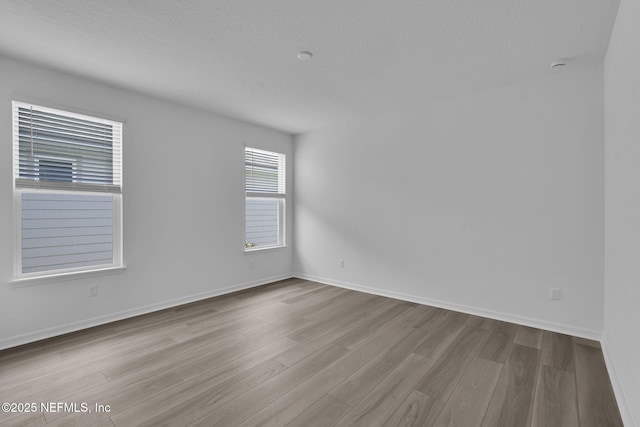 232 Fairlake Cir, Saint Augustine, FL 32092 - spare room featuring wood finished floors and a textured ceiling