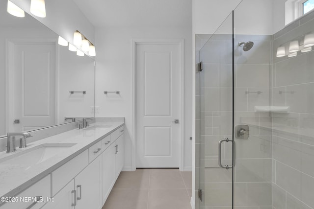 232 Fairlake Cir, Saint Augustine, FL 32092 - bathroom with double vanity, a shower stall, and tile patterned floors