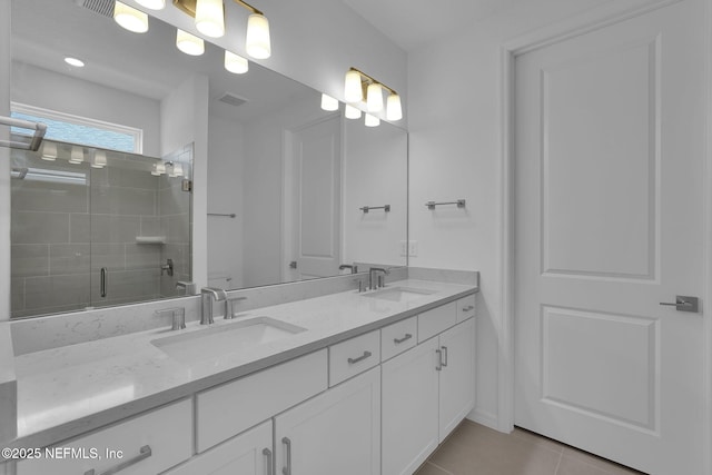 232 Fairlake Cir, Saint Augustine, FL 32092 - full bath with double vanity, a stall shower, and tile patterned flooring