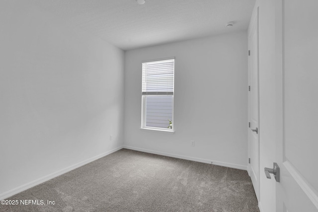 232 Fairlake Cir, Saint Augustine, FL 32092 - carpeted empty room with a smoke detector and baseboards