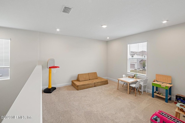 rec room with recessed lighting, visible vents, and carpet