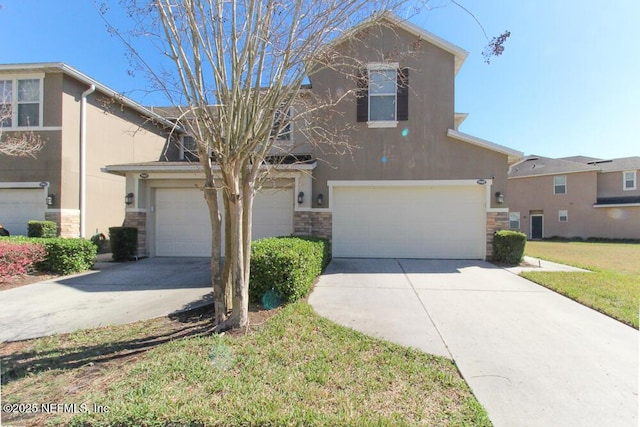 view of front of property with a front lawn and a garage