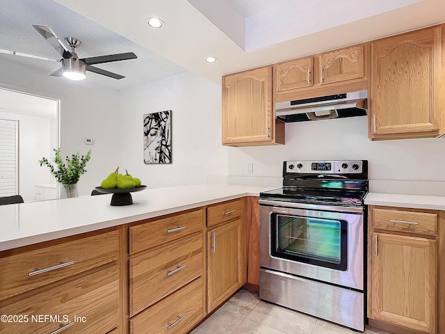 kitchen with light tile patterned floors, light brown cabinets, ceiling fan, and stainless steel electric range oven