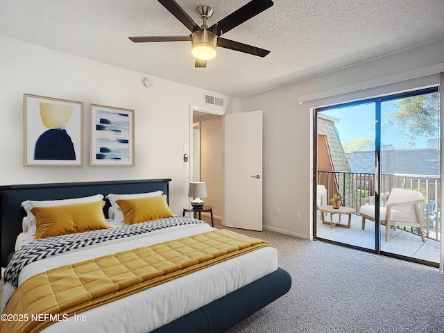 carpeted bedroom featuring ceiling fan, access to outside, and a textured ceiling