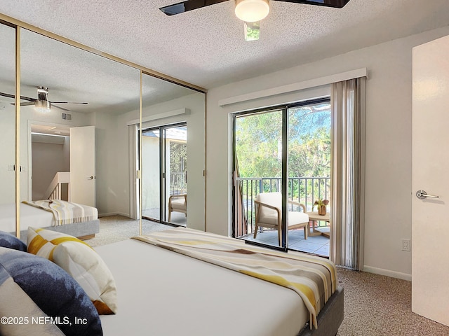 bedroom featuring ceiling fan, a textured ceiling, carpet, and access to outside