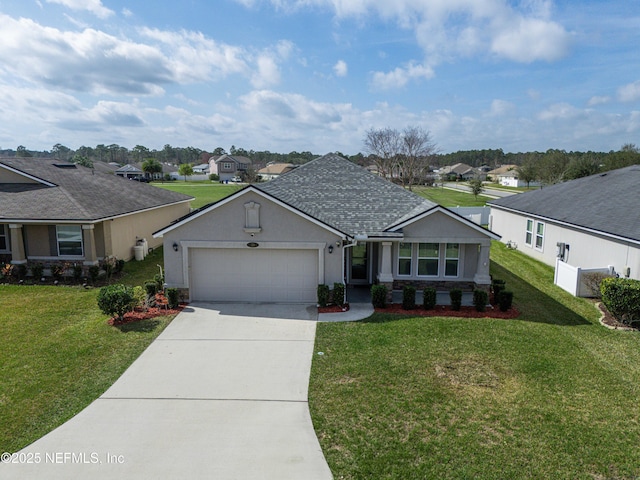 ranch-style home featuring a garage and a front lawn