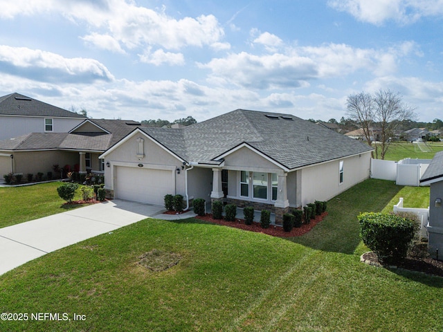 view of front facade featuring a garage and a front yard