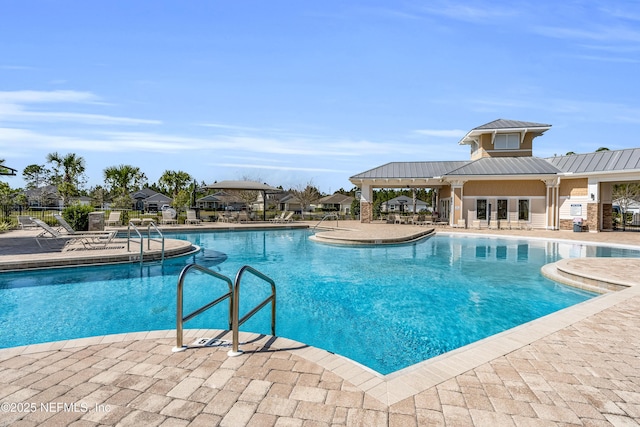 view of swimming pool featuring a patio