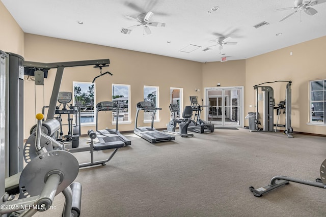 exercise room with ceiling fan